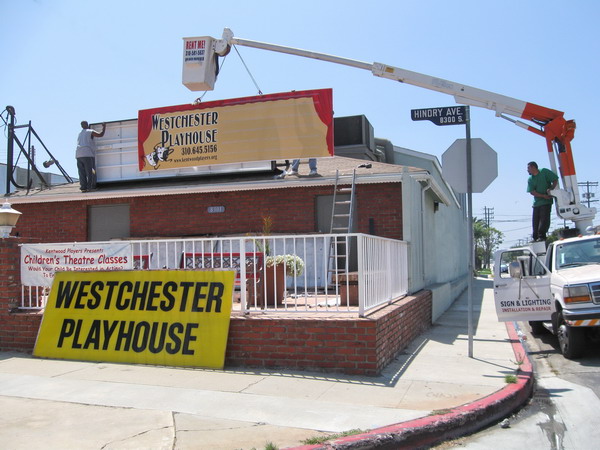 A crane installs the new marquee.